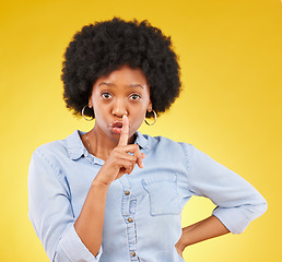 Image showing Privacy, secret and finger on lips of black woman in studio for mystery, gossip and announcement. Noise, news and whisper with female and shush gesture on yellow background for rumor, drama or silent