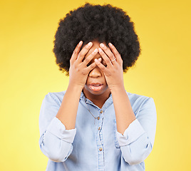 Image showing Black woman, stress and hands on angry face, tired and mental health with anxiety by yellow background. Girl, frustrated and studio backdrop with mind fatigue, depression and disappointed with afro