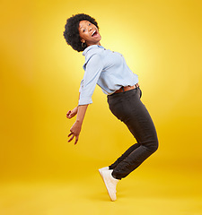 Image showing Wow, excited and happy black woman in dance pose on yellow background with energy, happiness and smile. Winner mockup, celebration and isolated girl dancing for freedom, winning and success in studio