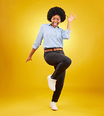 Image showing Happy, excited and portrait of black woman on yellow background with energy, happiness and smile in studio. Winner mockup, celebration and isolated girl pose for deal announcement, sale and success
