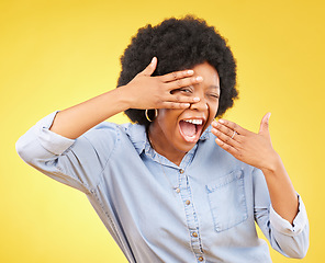 Image showing Excited black woman surprised hand on face and shocked winning person isolated in studio yellow background. Portrait, V and female winner happy for a deal, sale and announcement of good news