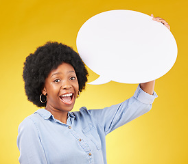 Image showing Speech bubble, portrait and happy black woman in studio with mockup for social media, advertising or space. Face, poster and girl with billboard on news, announcement or branding on yellow background