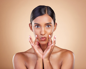 Image showing Portrait, beauty and pout a model woman in studio on a beige background for natural skincare. Face, lips and kiss with an attractive young female posing for aesthetic, cosmetics or luxury wellness