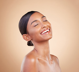 Image showing Woman, smile and face in beauty skincare cosmetics or makeup against a studio background. Happy relaxed female model smiling in happiness and satisfaction for perfect skin, self love or facial care