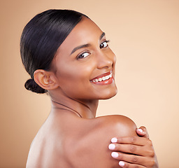Image showing Indian woman, beauty and skincare portrait with smile, looking over shoulder or wellness by background. Young asian model, gen z girl or cosmetics for natural skin glow, aesthetic makeup or happiness