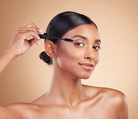 Image showing Portrait of woman, eyebrow or mascara makeup for beauty, cosmetic beauty or self care in studio background. Luxury, model face or eyes of Indian girl with cosmetics brush, skincare or application