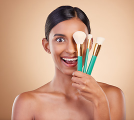 Image showing Girl, brushes or makeup artist with beauty, facial products or luxury self care on studio background. Wow, happy model face or excited young Indian woman with cosmetics, glowing skincare or smile