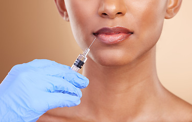 Image showing Lip filler, beauty or lips of Indian woman with injection for plastic surgery, cosmetics or botox in studio. Skincare, dermatology or zoom of girl with needle in mouth, face lift or facial treatment