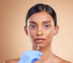 Image showing Lip filler, beauty or portrait of Indian woman with injection for plastic surgery, cosmetics or botox in studio. Skincare, dermatology or girl with needle in anti aging, face lift or facial treatment