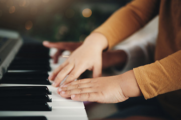 Image showing Learning, piano and hands of a child and parent playing a song together. Education, music and zoom of a kid with a dad teaching an instrument during a musical lesson, help and showing to play