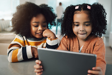 Image showing Sisters, children and girls smile with tablet in home, playing games and bonding together. Technology, family and happy mixed race kids with touchscreen for elearning, streaming movie or web browsing