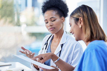 Image showing Women, doctors and team planning paperwork, documents and test results in medical office. Healthcare management of black woman with notes, collaboration and discussion of hospital research analysis