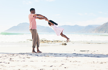 Image showing Ocean, black man swinging child and playful family holiday in Australia with freedom and energy. Travel, spinning and happy father and girl with smile playing and bonding together on beach vacation.