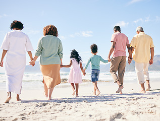Image showing Family walk on beach sand, holding hands and generations, people outdoor with grandparents, parents and kids. Together, support and trust, travel to Bali with love, care and bond with back view