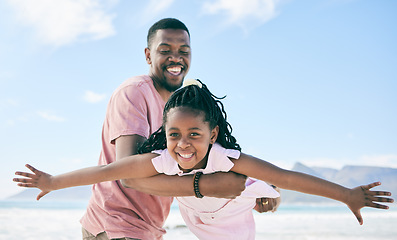 Image showing Child, black man and airplane game on beach on playful family holiday in Australia with freedom and energy. Travel, fun and happy father and girl with smile playing and bonding together on vacation.