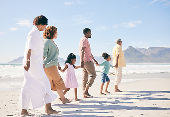 Image showing Family is walking on beach, travel and holding hands with generations, unity and freedom with love, together outdoor. Grandparents, parents and children, people on holiday with tropical destination