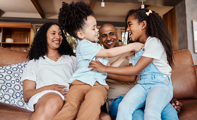 Image showing Happy, tickle and relax with family on sofa for bonding, affectionate and laughing. Funny, free time and smile with parents and children playing in living room at home for care, weekend and games