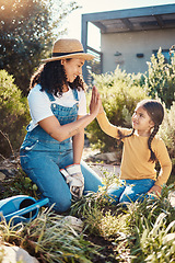 Image showing Family, children or high five with a mother and daughter gardening while planting plants together. Nature, kids or landscaping with a woman and female child working in the garden during spring