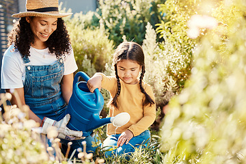 Image showing Family, children or watering with a mother and daughter gardening together in the backyard. Plants, kids or landscaping with a woman and female child working in the garden during spring