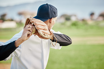 Image showing Pitcher, back view or sports man in baseball stadium in a game on training field outdoors. Fitness, young softball athlete or focused man pitching or throwing a ball with glove in workout or exercise