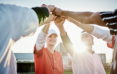 Image showing Fist, motivation or sports men in huddle with support, hope or faith on baseball field in fun game together. Teamwork, hands up or group of excited softball athletes with goals, mission or solidarity