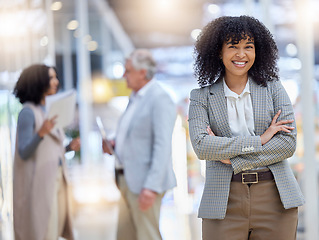 Image showing Young business woman, portrait and arms crossed for empowerment, motivation and confident leader. Happy female employee standing in company for professional career, pride or happiness in busy office