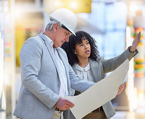 Image showing Man, woman and construction team pointing at building site, blueprint ideas and discussion of design. Diversity, project management and architecture for infrastructure, engineering and floor planning