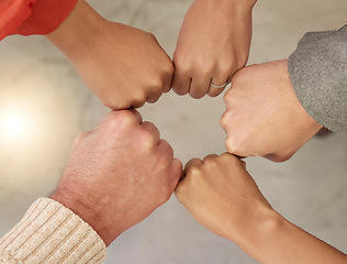 Image showing Teamwork, top view or fist of business people in circle for motivation, corporate community or hope together. Collaboration, diversity or hands of employees meeting for our vision, strategy or goals