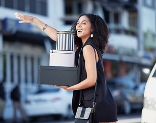 Image showing Black woman, gift boxes and present box of a customer hail taxi outdoor in the city. Fashion sale, boutique and retail store promotion of a happy person done shopping and looking for transport