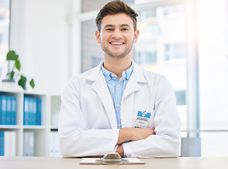 Image showing Medical, smile and portrait of happy doctor in a hospital office feeling happy, excited and proud in a clinic. Young, medicine and man healthcare professional arms crossed satisfied with health