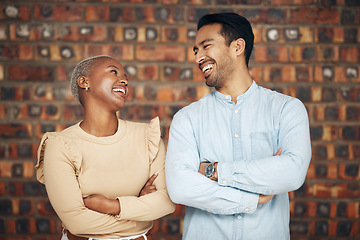 Image showing Teamwork, arms crossed and business people laughing in office workplace at funny joke or comedy. Collaboration, comic diversity and happy man and black woman together for team building and confidence