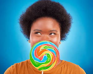 Image showing Sweet, happiness and black woman with lollipop, excited and lady on blue studio background. African American female, candy and girl with dessert, happy and cheerful with joy, treat and confectionary