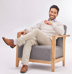 Image showing Relax, chair and portrait of business man sitting happy with a smile and crossed legs isolated in studio white background. Gentleman, confident and professional or proud male employee or entrepreneur