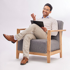 Image showing Psychologist, doctor and mental health, man with smile in portrait and clipboard for medical checklist on studio background. Sitting on chair, therapy and happy male with advice, help and psychology