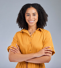 Image showing Happy, pride and portrait of a woman with arms crossed isolated on a studio background. Smile, proud and headshot of a corporate employee with confidence, success and happiness on a backdrop