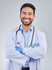 Image showing Doctor, man and portrait in a studio with a smile from success, motivation and stethoscope. Happiness, medical consultant and hospital worker with white background smiling about health and wellness