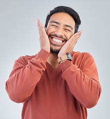 Image showing Happy, smile and face of man on a white background with emoji, comic and facial expression in studio. Wow mockup, omg surprise and isolated excited male with good news, success and winner reaction