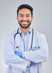 Image showing Doctor, happy man and portrait in a studio with a smile from success, motivation and stethoscope. Happiness, medical consultant and hospital worker with gray background smiling about health vision