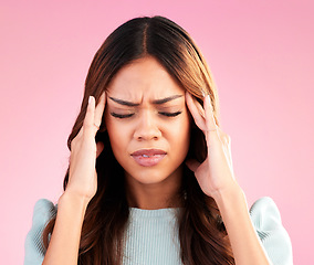 Image showing Stress, anxiety and depression, woman with headache in studio, tired and exhausted on pink background. Mental health, burnout and depressed hispanic model with hand on head in pain and temple massage