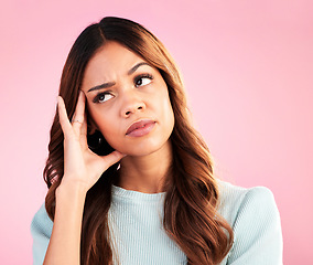 Image showing Thinking, burnout and annoyed woman in studio, tired and exhausted isolated on pink background. Mental health, doubt and irritated hispanic model, hand on head in confusion with problem or brain fog.