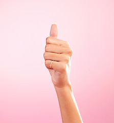 Image showing Thumbs up, ok and hand of woman in studio for success, approval, achievement and support. Like, emoji and thank you with female and gesture isolated on pink background for positive, agreement and yes
