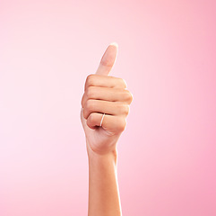 Image showing Thumbs up, yes and hand of woman in studio for success, approval, achievement and support. Like, emoji and thank you with female and gesture isolated on pink background for positive, agreement and ok