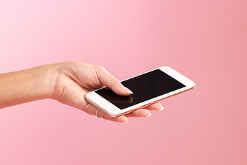 Image showing Phone mockup, hands and screen in studio isolated on a pink background. Cellphone, social media and woman with mobile smartphone for branding, advertising or marketing for product placement space.