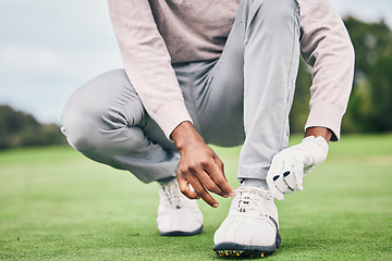 Image showing Sports, laces and shoes of man on golf course for training, games and tournament match. Ready, start and tying with male athlete playing in club on lawn field for relax, golfing and competition