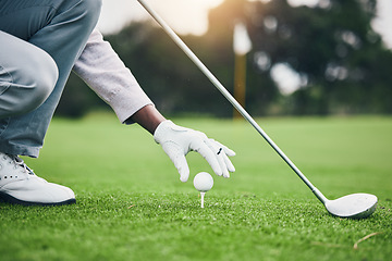 Image showing Training, golf ball and tee with hand of black man on field for sports, tournament and challenge. Start, competition match and ready with athlete and club on course for action, games and hobby