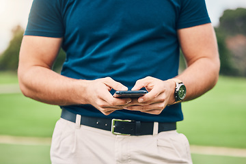 Image showing Man, hands and phone texting in communication on golf course for sports, social media or networking outdoors. Hand of sporty male chatting on smartphone or mobile app for golfing research or browsing