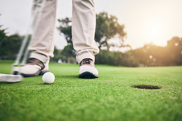 Image showing Golf, hole and legs of athlete or player hit ball and professional golfer training and putting on a filed as exercise or workout. Feet, equipment and gentleman or person relax and playing a sport