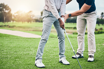 Image showing Golf lesson, sports teaching and coach hands helping a man with swing and stroke outdoor. Lens flare, green course and club support of a athlete ready for exercise, fitness and training for a game