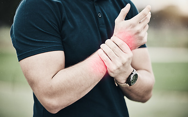 Image showing Sport, injury and golf, man with wrist pain during game on course, massage and outdoor relief in health and wellness. Green, hands on arm in support and golfer with ache from swing in golfing workout