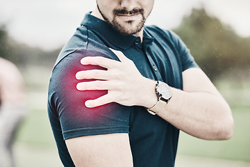 Image showing Sports, shoulder pain and man on golf course holding arm during game massage and relief in health and wellness. Green, zoom on hands on muscle for support and golfer with ache during golfing workout.